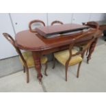 Edwardian mahogany extending dining table together with six balloon back chairs (set of 4 plus two