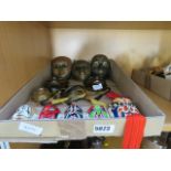 A box containing a quantity of Japanese and Venetian-style ornamental masks