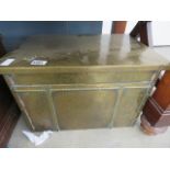 A brass clad coal box