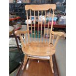 A beech stick back rocking chair