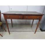 Oak writing table with a tooled leather surface and turned legs