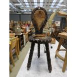 (24) Wooden tripod chair with goat skin seat and back