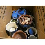 A box containing blue glazed Devon pottery