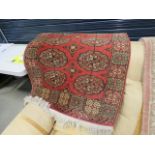 Red Bokhara mat plus two pink and beige floral rugs