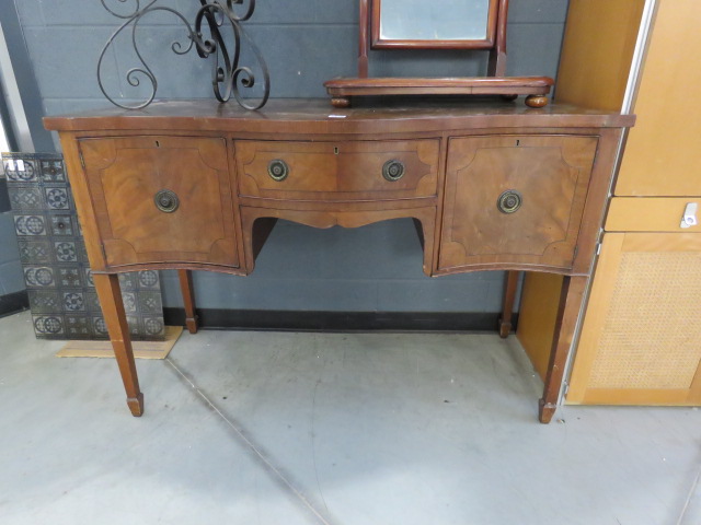 A mahogany serpentine fronted sideboard