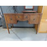 A mahogany serpentine fronted sideboard