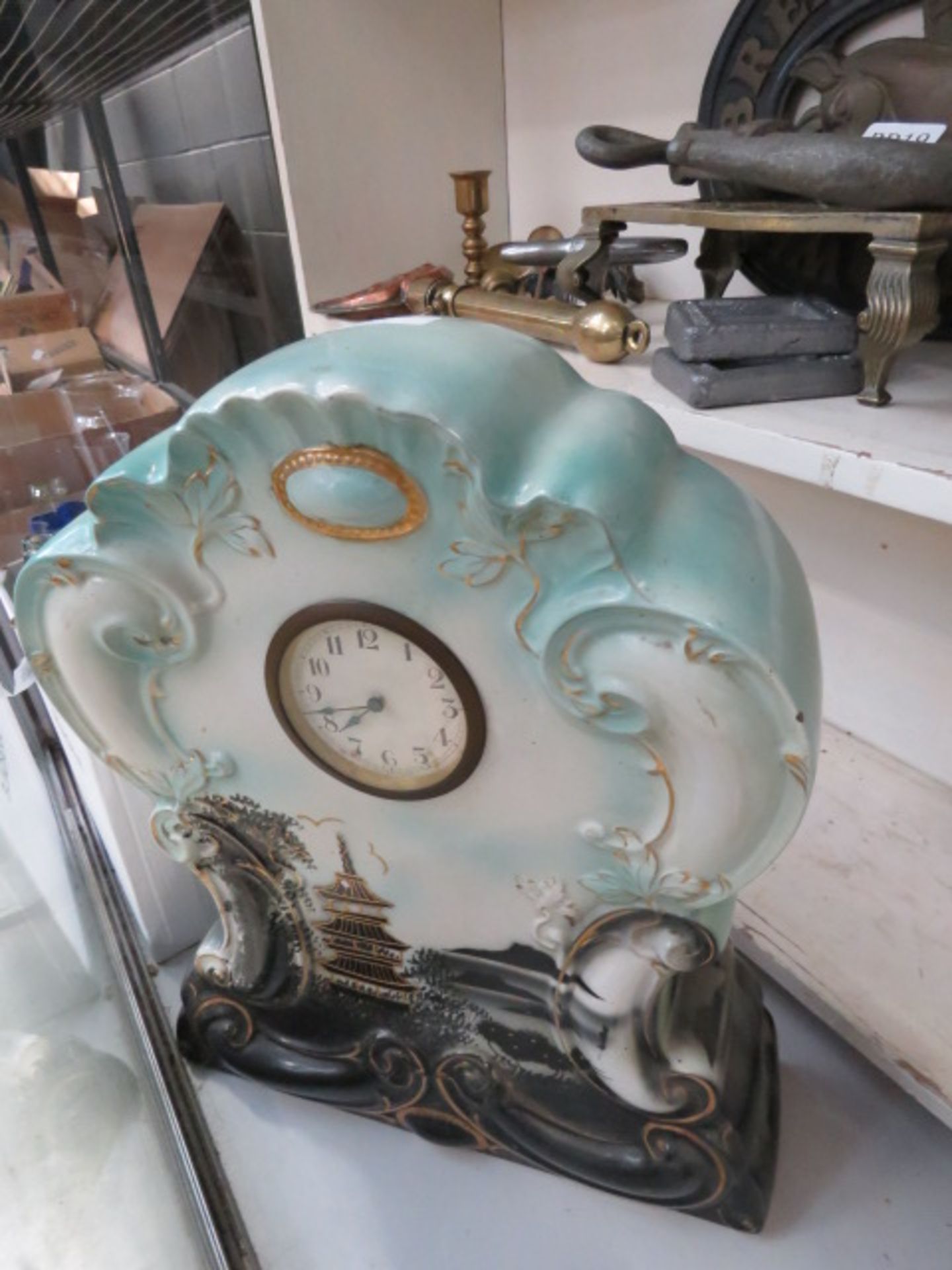 A large pottery mantle clock