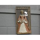 A reside wall plaque of an English queen