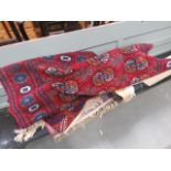 Two red Bokhara style mats