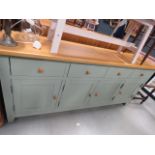 Sage green sideboard with natural oak surface