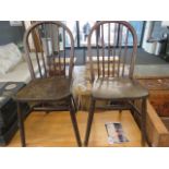 A pair of elm seated stick back provincial chairs