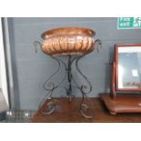 A hammered copper Victorian bowl with wrought iron stand, plus a stainless steel mixing bowl