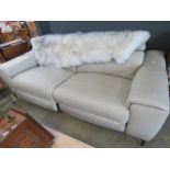 A cream leather effect 2 seater reclining sofa