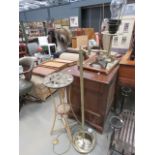 Quartz wall clock, a floor lamp and a bent case plant stand