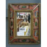 (24) A small ornamental chinoiserie mirror in coloured glass frame