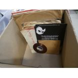 A box containing vinyl records