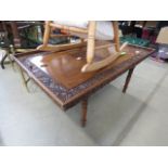 A carved wooden coffee table