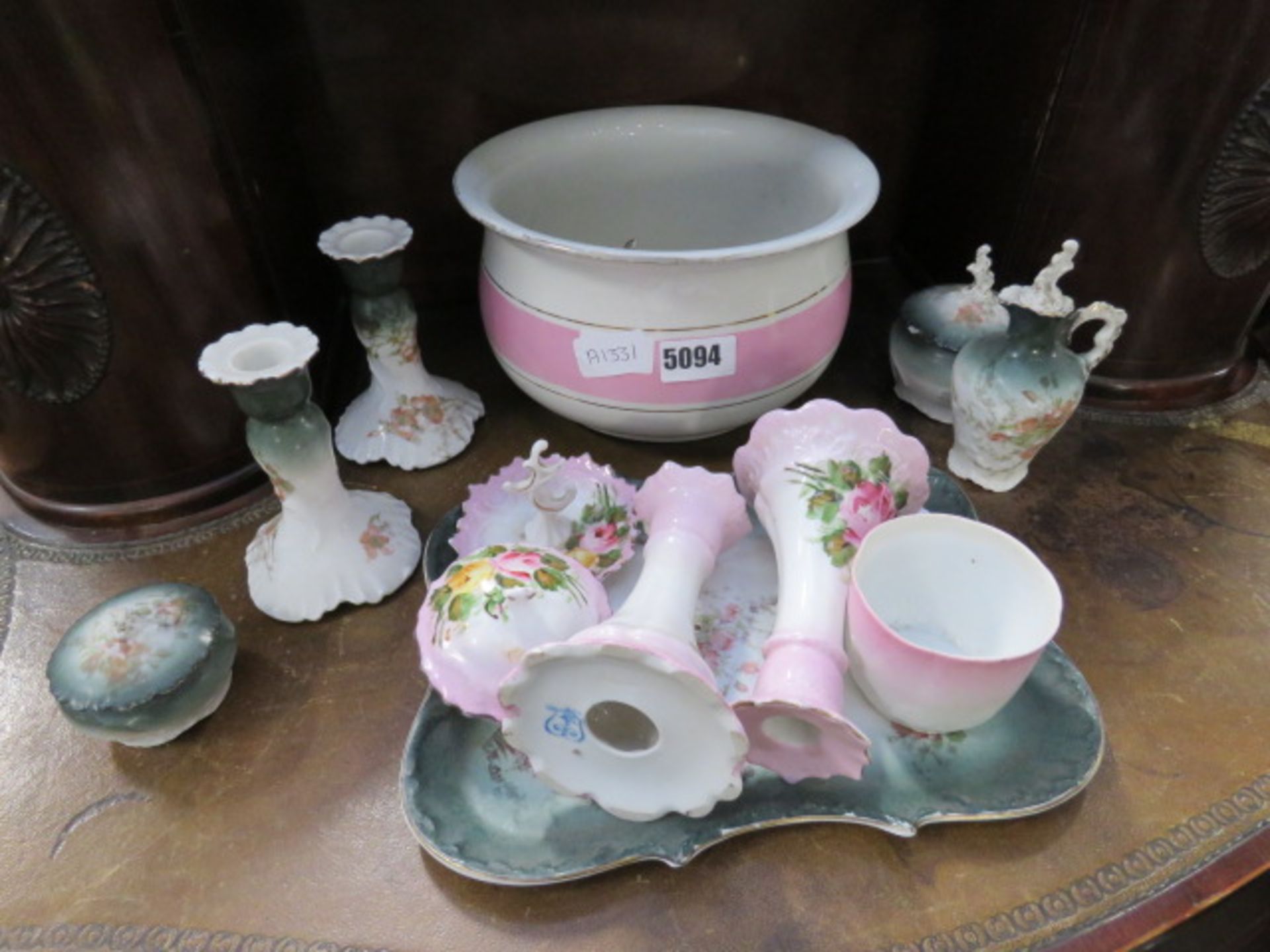 A quantity of late Victorian china, to include: candlesticks, chamberpot, ring tree and a dressing