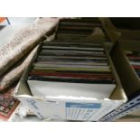 2 boxes containing vinyl records