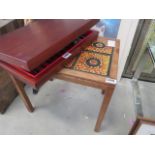 A tile topped teak side table