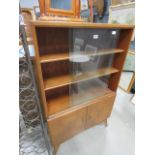 1950's bookcase with glazed sliding doors and cupboard under