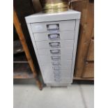 Narrow metal filing cabinet