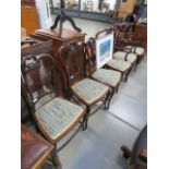 A carved Edwardian parlour suite, comprising: 2 armchairs and 4 other chairs