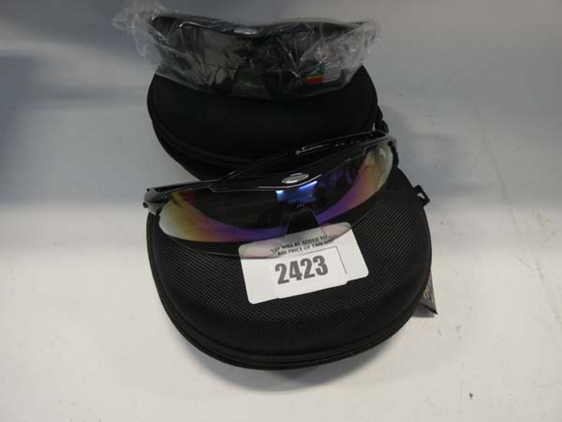 2 Pairs of Rock Bros protective eye wear with accessories and cases.