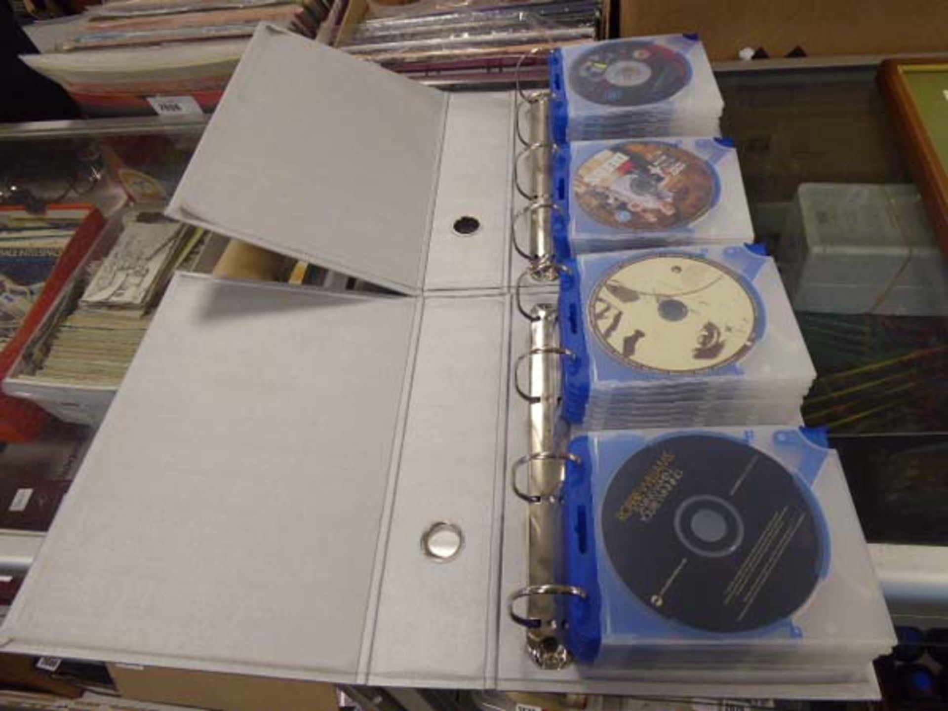 2 binders containing selection of movies and CD music