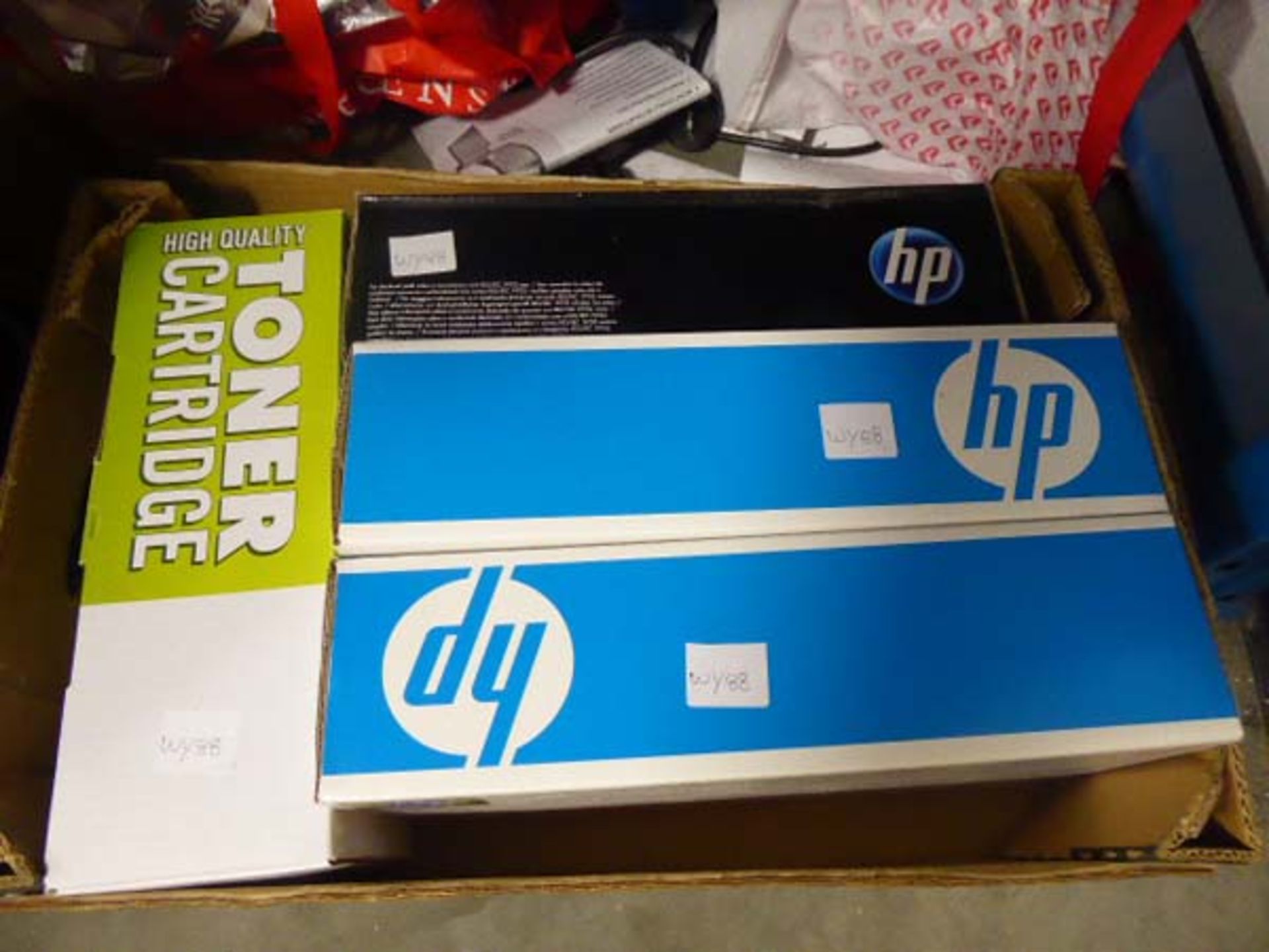 Tray containing 4 replacement toner cartridges, 3 by HP