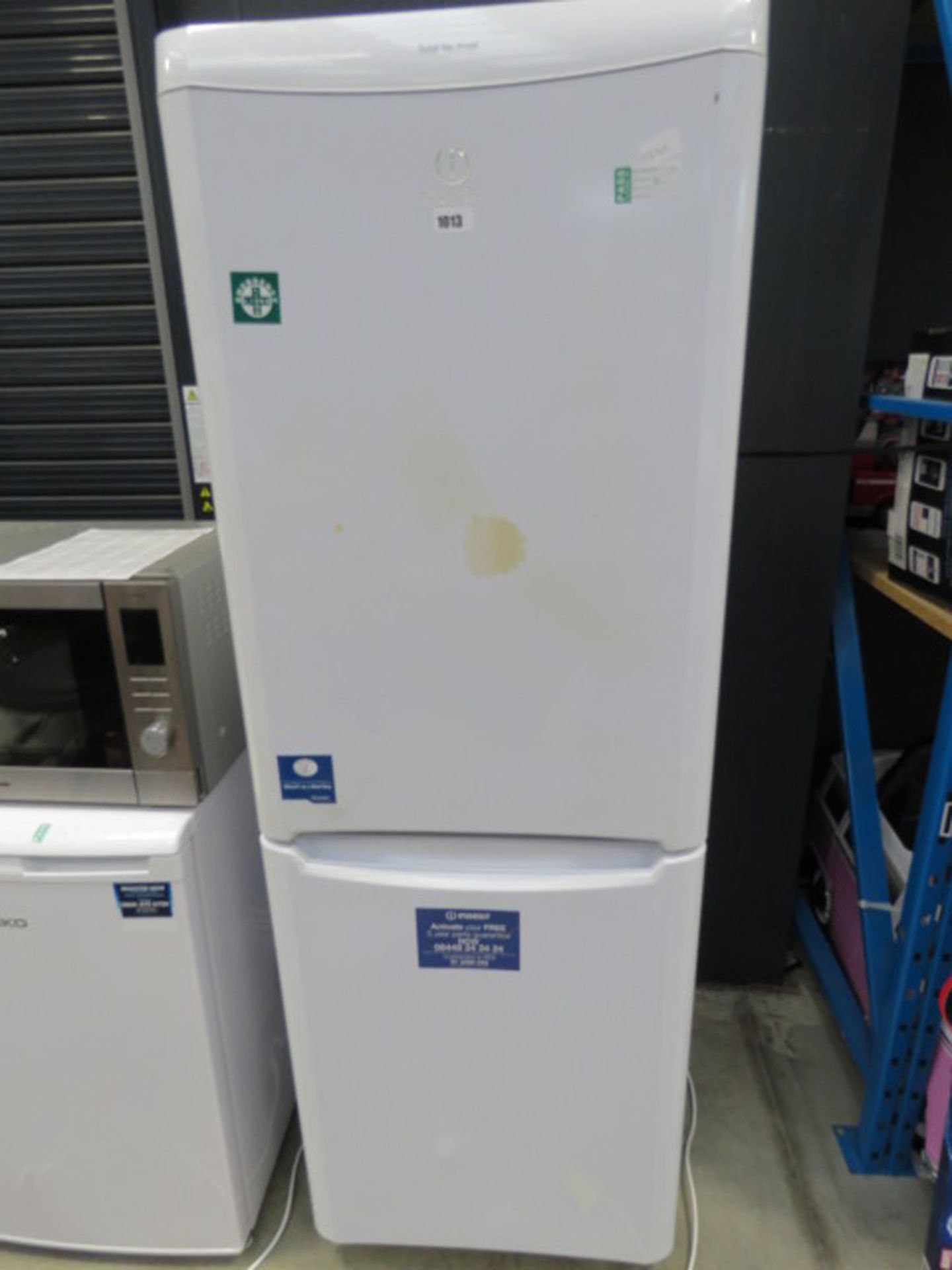 (114) Indesit white double fridge freezer