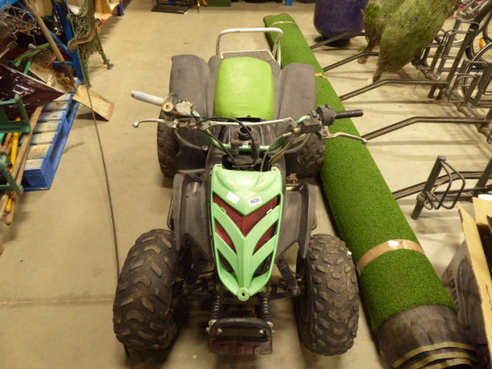 Green petrol powered quad bike