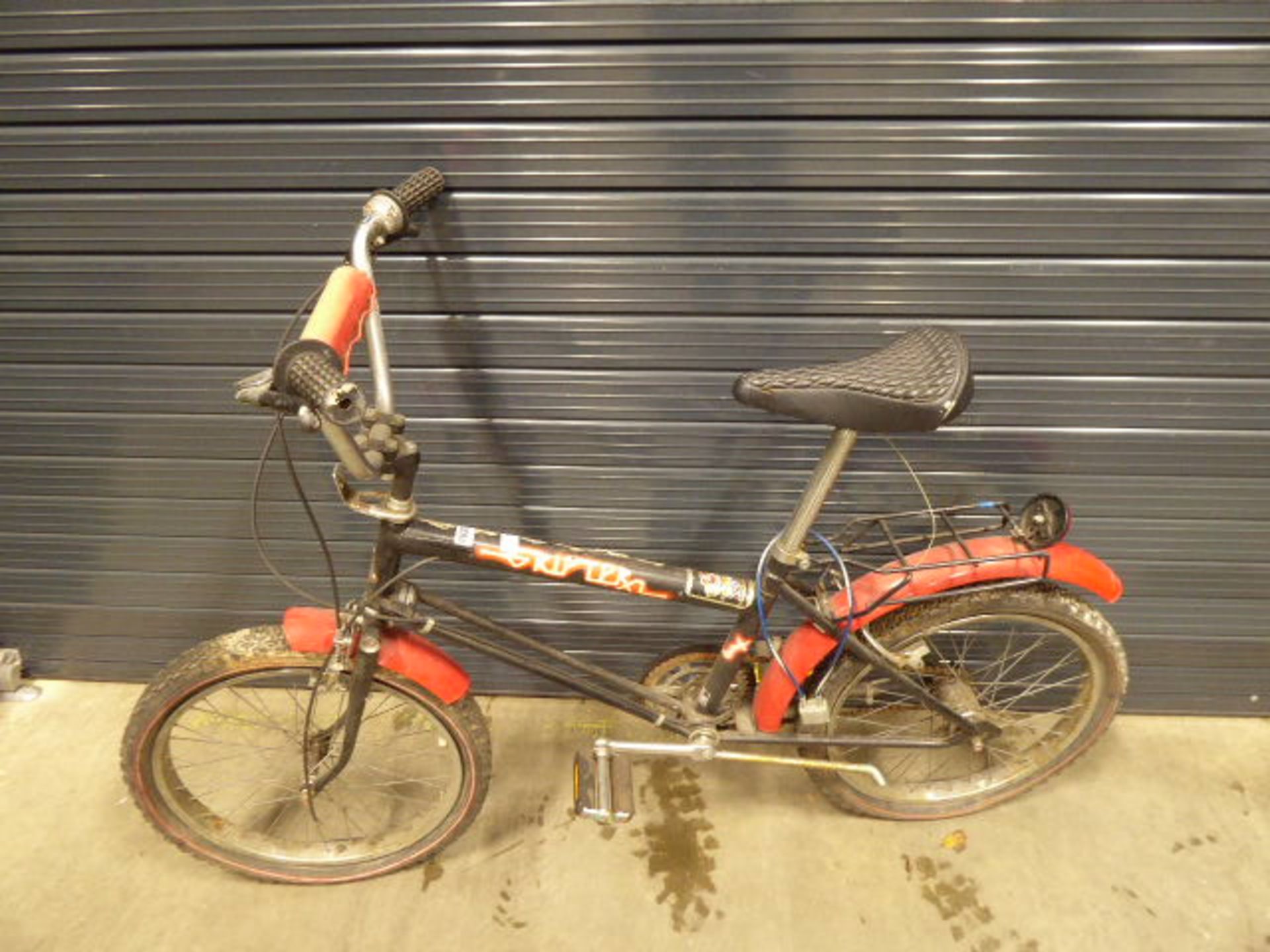 Red and black Raleigh Grifter child's cycle
