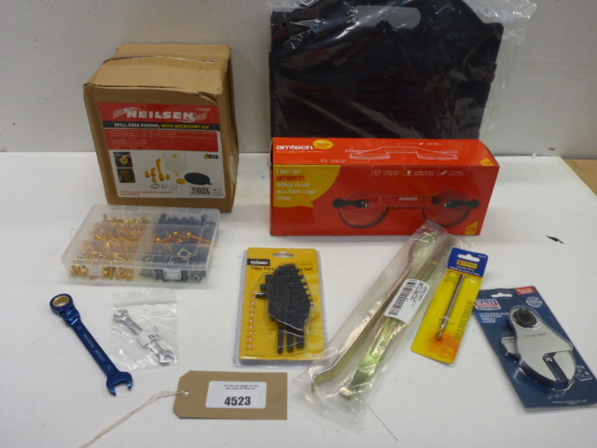 Bag containing spill free funnels, suction cup lifter, toolbags, Hex piece set, tyre levers and