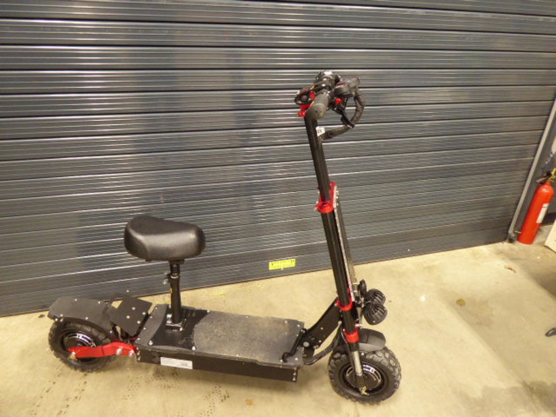 Red and black heavy duty 3 speed electric scooter with chargers