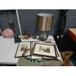 Quantity of prints, engravings, ornamental boomerang, table lamps, and carved wooden figure