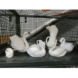 Cage containing ornamental swan bowls