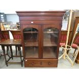 Victorian glazed double door bookcase with drawers under
