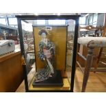 Cased figure of a geisha girl