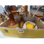 Box containing barrels, whiskey bottles, ashtray and an AA badge