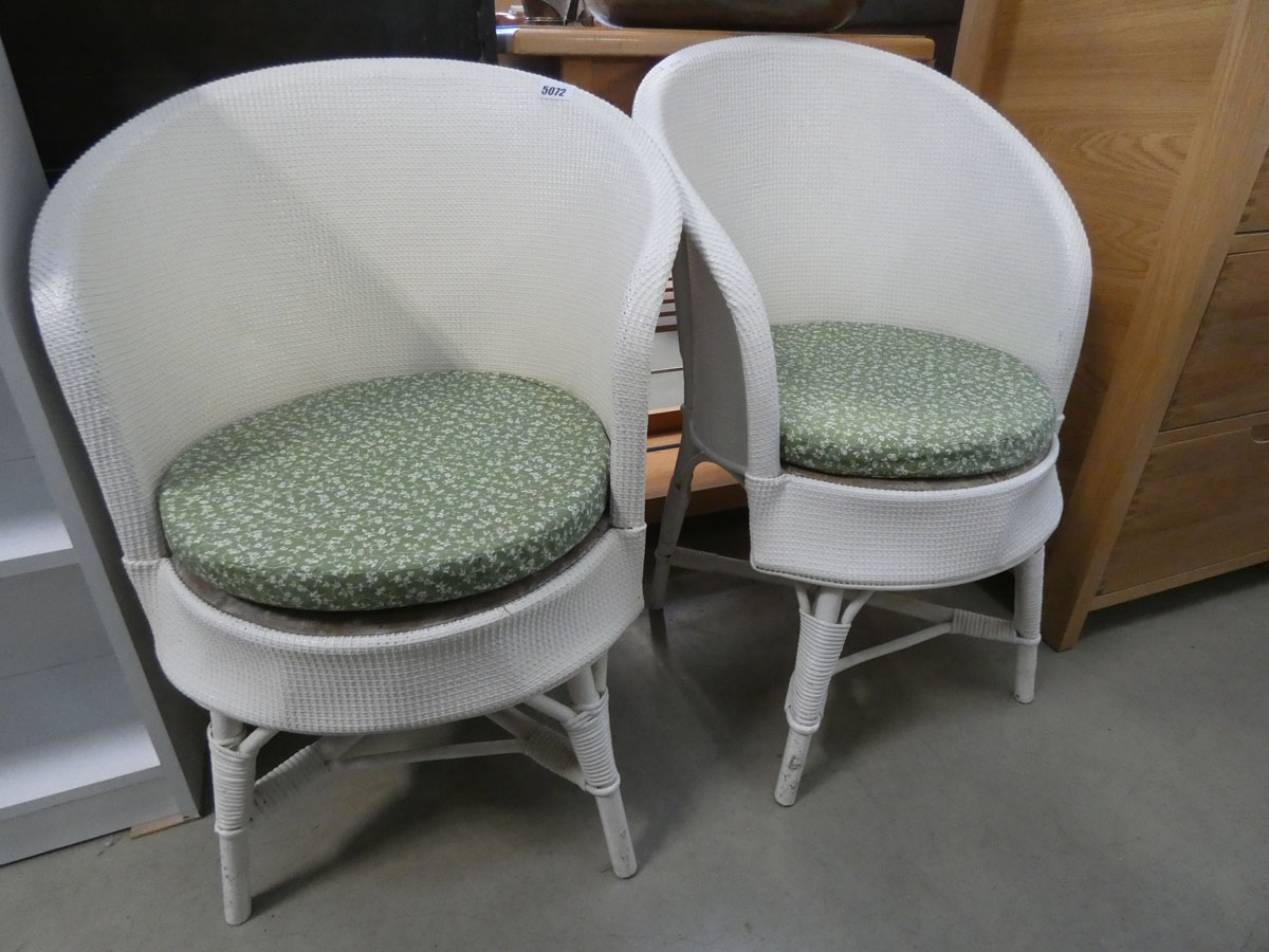 Pair of cream painted Lloyd Loom style chairs