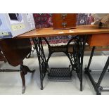 Singer sewing machine base with wooden top