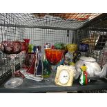 Cage containing tea pots, ornamental yatch, clock, and coloured wine glasses