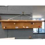 Hanging shelf with cartridge coat hooks