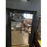 Rectangular bevelled mirror in black painted frame