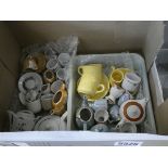 Box containing children's miniature tea services