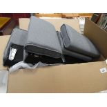 Box containing grey fabric sofa parts