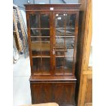 Glazed reproduction mahogany bookcase with cupboard under