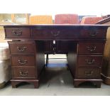 Reproduction mahogany twin pedestal desk with green leather surface