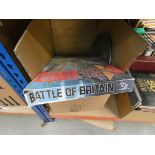 Box containing Battle of Britain game, ice bucket serving tray, floral patterned crockery and cake